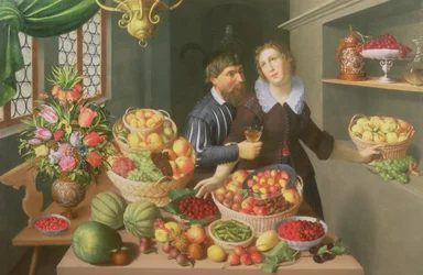 Hombre y mujer ante una mesa con frutas y verduras